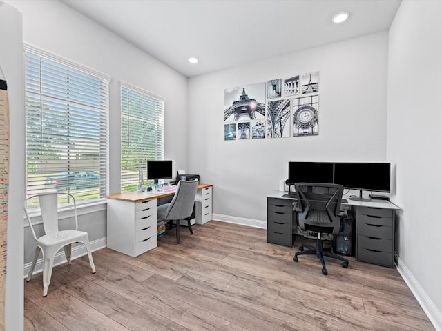 office area with light wood finished floors, baseboards, and recessed lighting