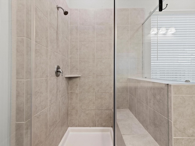 bathroom featuring tiled shower