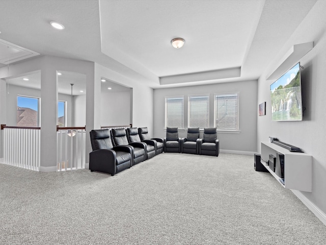 living room with recessed lighting, carpet floors, baseboards, a raised ceiling, and attic access