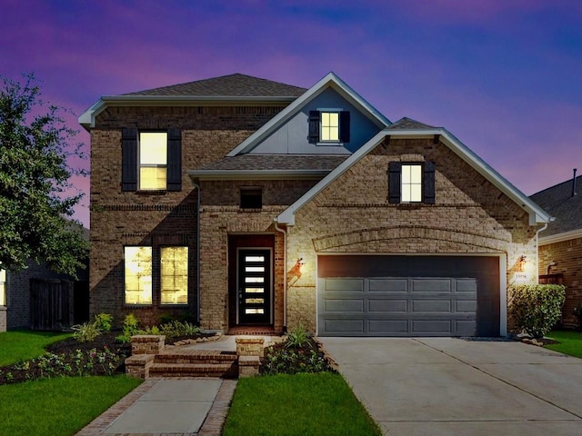 traditional home with concrete driveway, brick siding, roof with shingles, and an attached garage