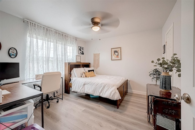 bedroom featuring ceiling fan and light wood-type flooring