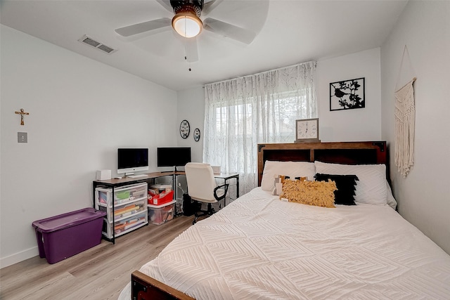 bedroom with ceiling fan and light hardwood / wood-style floors