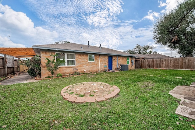 back of house with a pergola, central air condition unit, a yard, and a patio