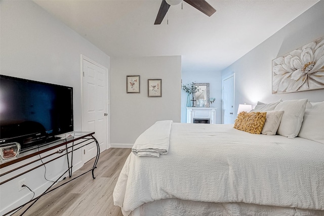 bedroom featuring ceiling fan and light hardwood / wood-style floors