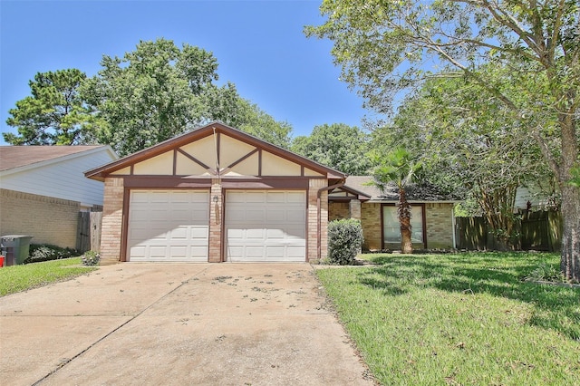 view of front facade with a garage and a front lawn