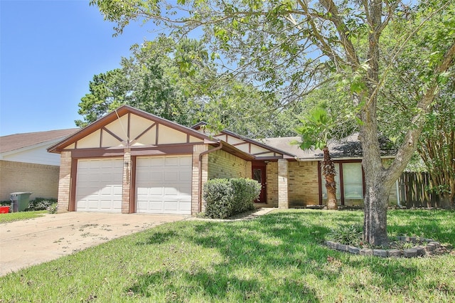 view of front of home with a garage and a front lawn