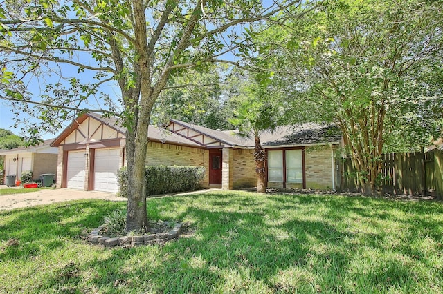 view of front of house featuring a garage and a front lawn