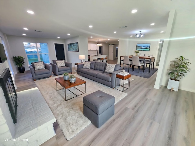 living room with light hardwood / wood-style floors