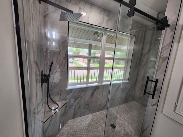 bathroom featuring plenty of natural light and an enclosed shower