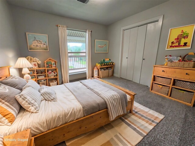 carpeted bedroom with a closet