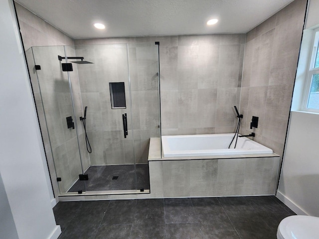 bathroom with tile patterned flooring, toilet, and plus walk in shower