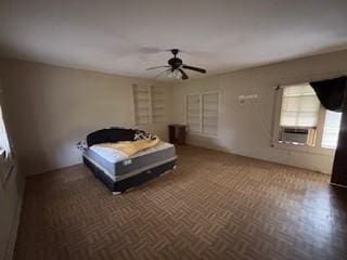 bedroom with ceiling fan, cooling unit, and dark parquet floors