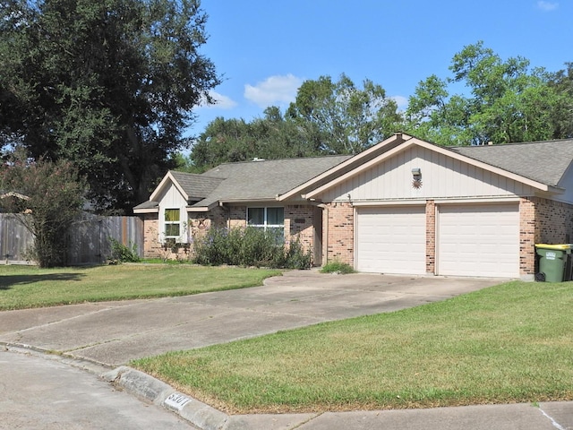 ranch-style home with a front yard and a garage