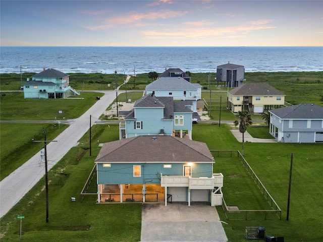 aerial view at dusk with a water view