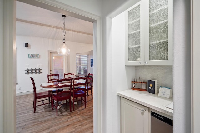 dining space with light wood-type flooring