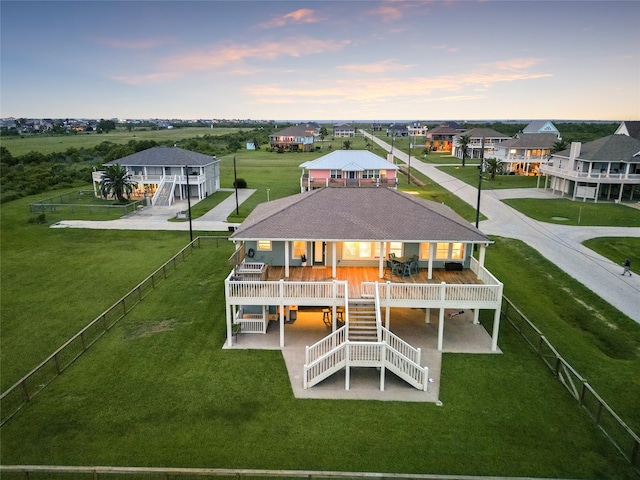 back house at dusk with a deck