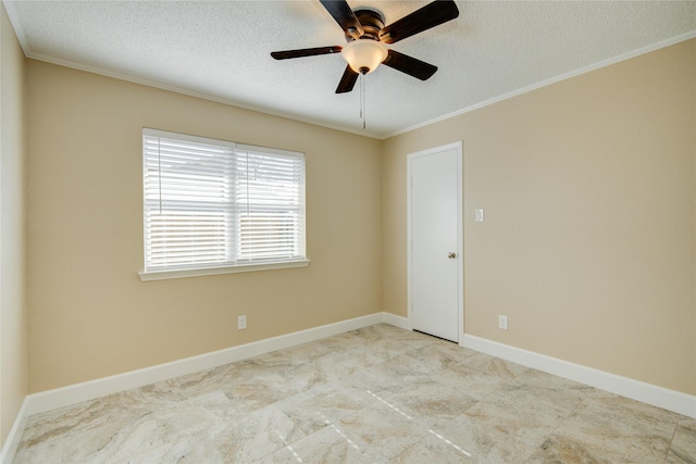 empty room featuring ceiling fan, ornamental molding, and a textured ceiling