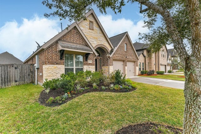 view of front facade with a garage and a front lawn