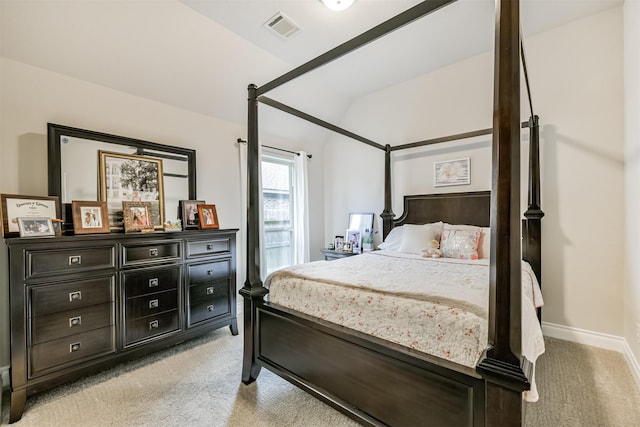 carpeted bedroom featuring lofted ceiling