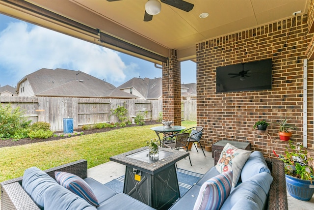 view of patio with ceiling fan and an outdoor hangout area