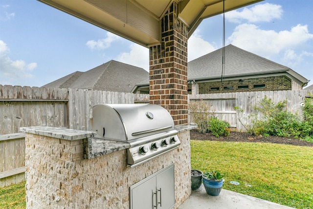 view of patio / terrace with area for grilling and an outdoor kitchen