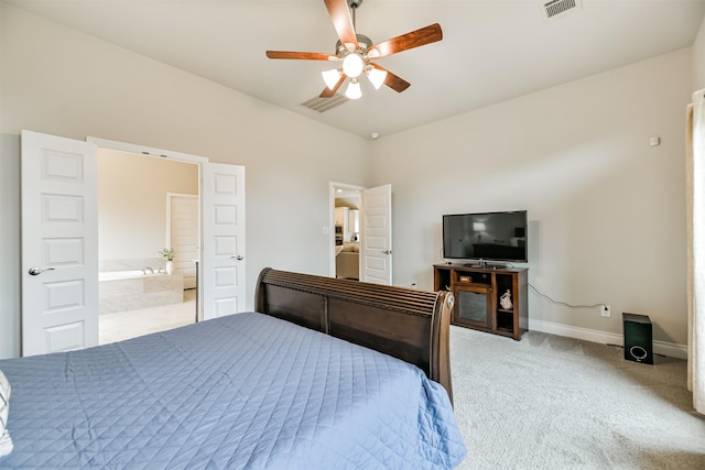 carpeted bedroom with ceiling fan and connected bathroom