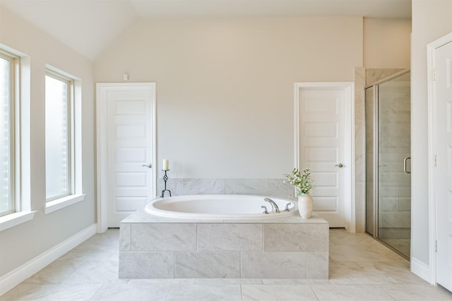 bathroom with plus walk in shower, a wealth of natural light, and vaulted ceiling