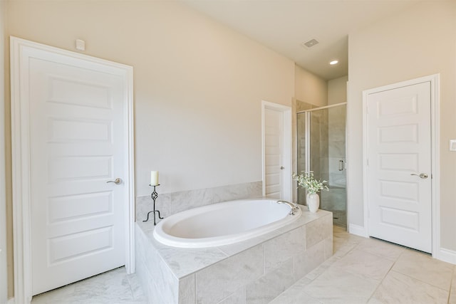 bathroom featuring plus walk in shower