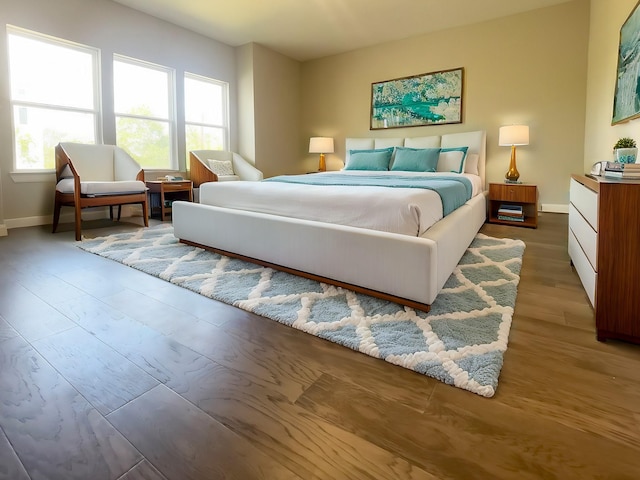 bedroom with hardwood / wood-style flooring