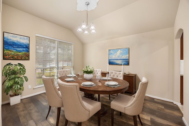 dining area with a chandelier, dark hardwood / wood-style flooring, and vaulted ceiling