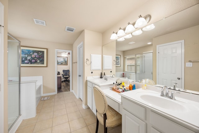 bathroom with shower with separate bathtub, vanity, and tile patterned floors