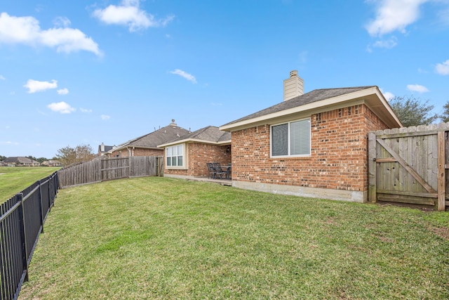 rear view of property with a lawn