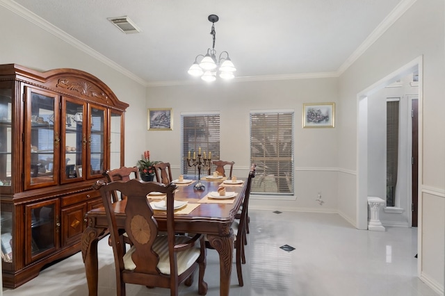 dining space featuring an inviting chandelier and ornamental molding