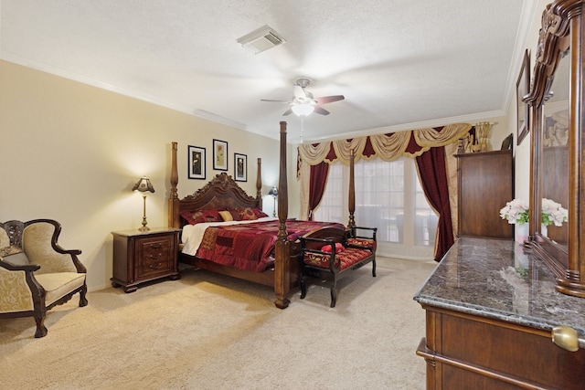 carpeted bedroom featuring crown molding, ceiling fan, and a textured ceiling