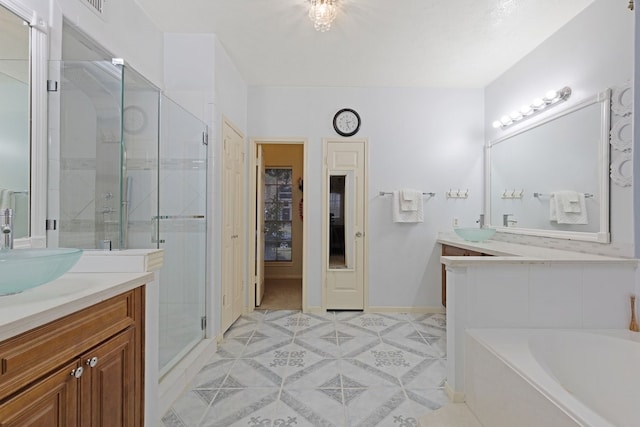 bathroom featuring tile patterned flooring, vanity, and separate shower and tub