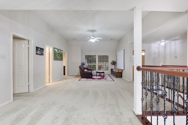 living area with lofted ceiling, light carpet, and ceiling fan