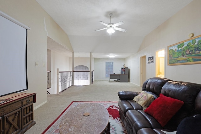 living room with lofted ceiling, light colored carpet, and ceiling fan