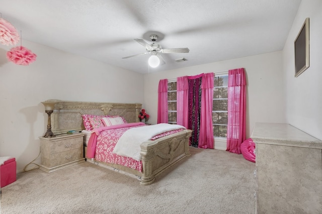 bedroom with light carpet and ceiling fan