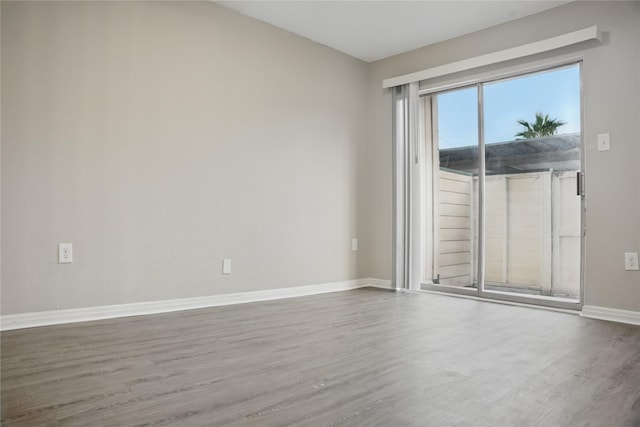 empty room featuring hardwood / wood-style floors