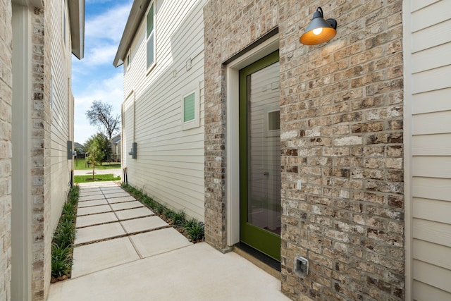 view of side of property with a patio