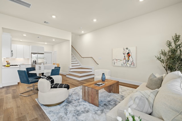 living room with light hardwood / wood-style flooring