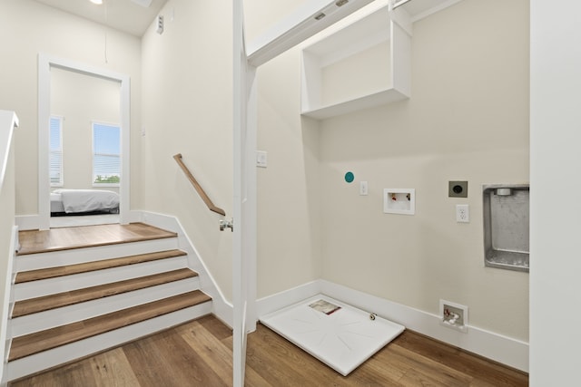 washroom with gas dryer hookup, hookup for a washing machine, wood-type flooring, and hookup for an electric dryer