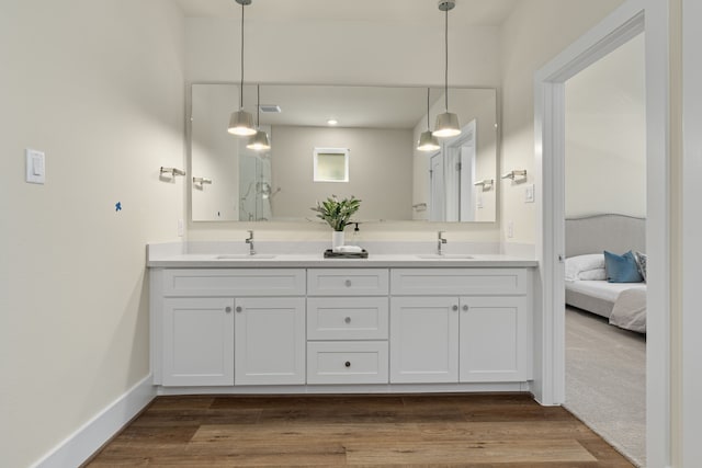 bathroom featuring vanity and hardwood / wood-style flooring