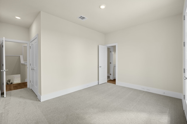 unfurnished bedroom with light carpet