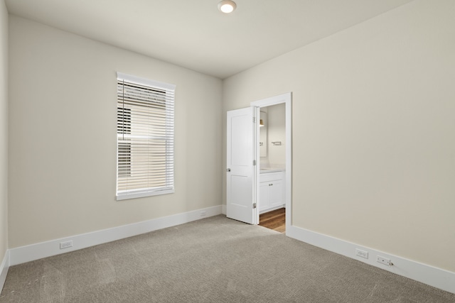 spare room with light colored carpet