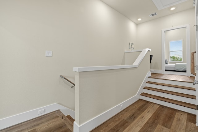 stairway featuring hardwood / wood-style flooring