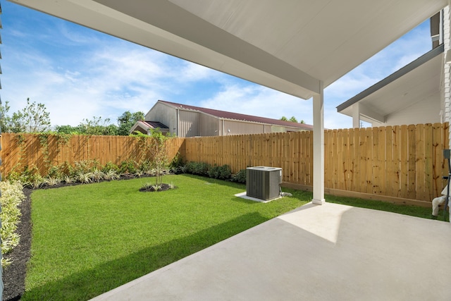 view of yard featuring central AC and a patio area