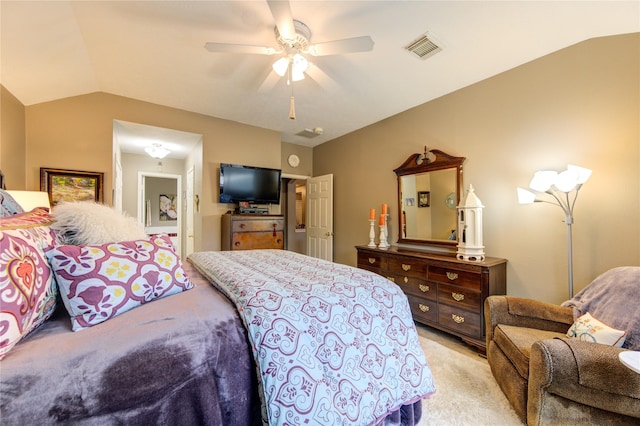 carpeted bedroom featuring ceiling fan and vaulted ceiling