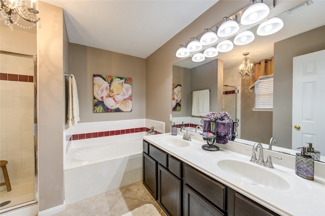 bathroom with tile patterned flooring, vanity, independent shower and bath, and a chandelier