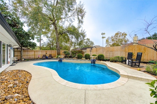 view of pool featuring a patio area and pool water feature